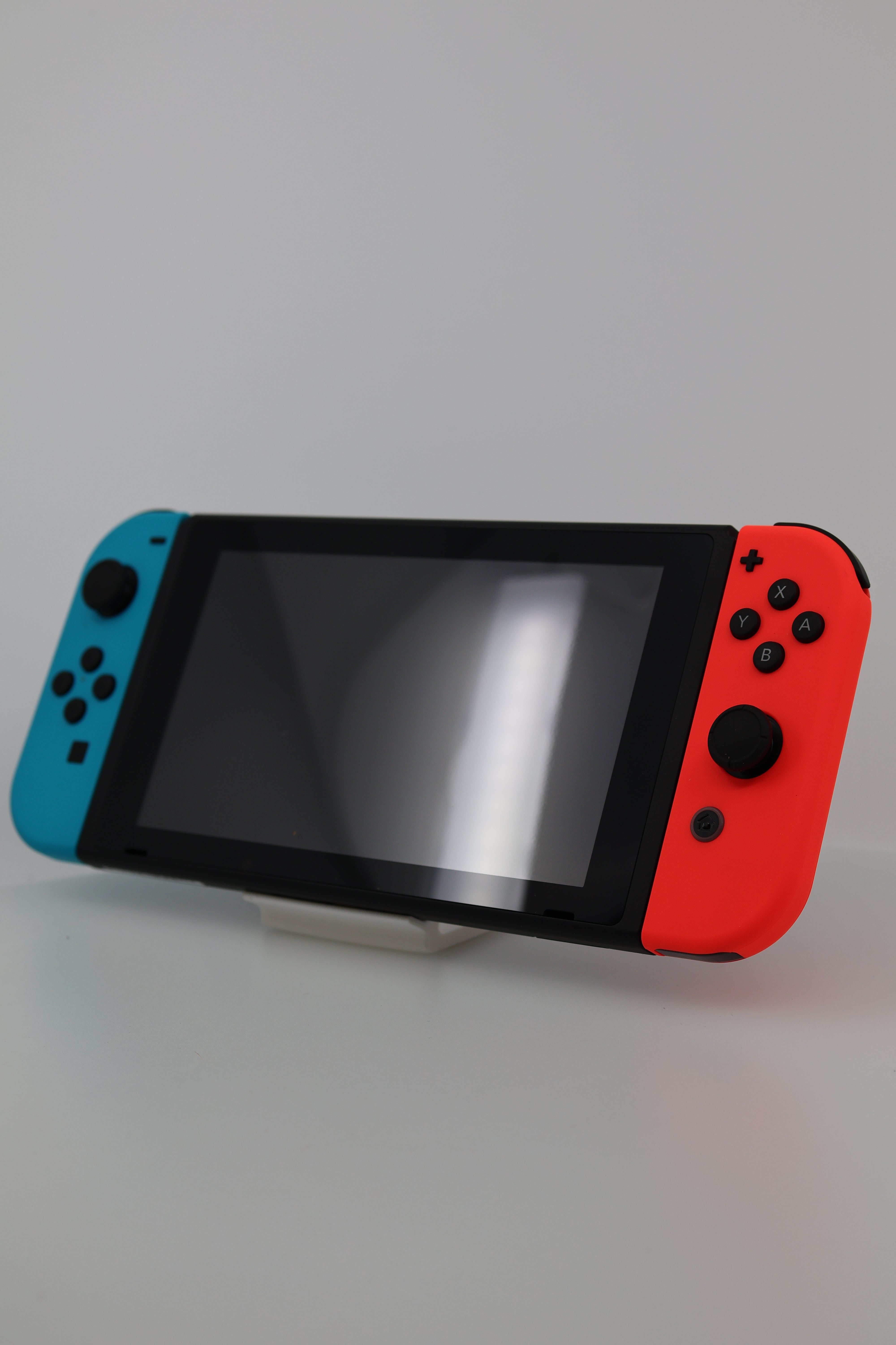 Nintendo Switch with Neon Blue and Neon Red Joy-Con