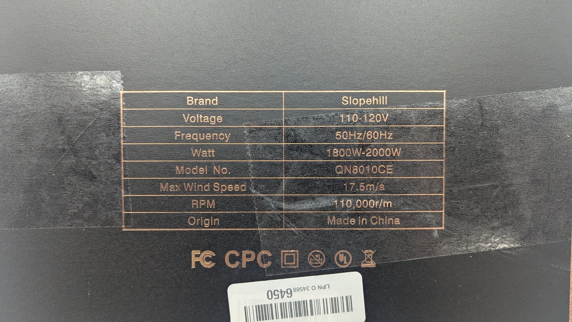 Specifications label on Slopehill Ionic Hair Dryer packaging showing voltage, frequency, wattage, model number, and RPM.