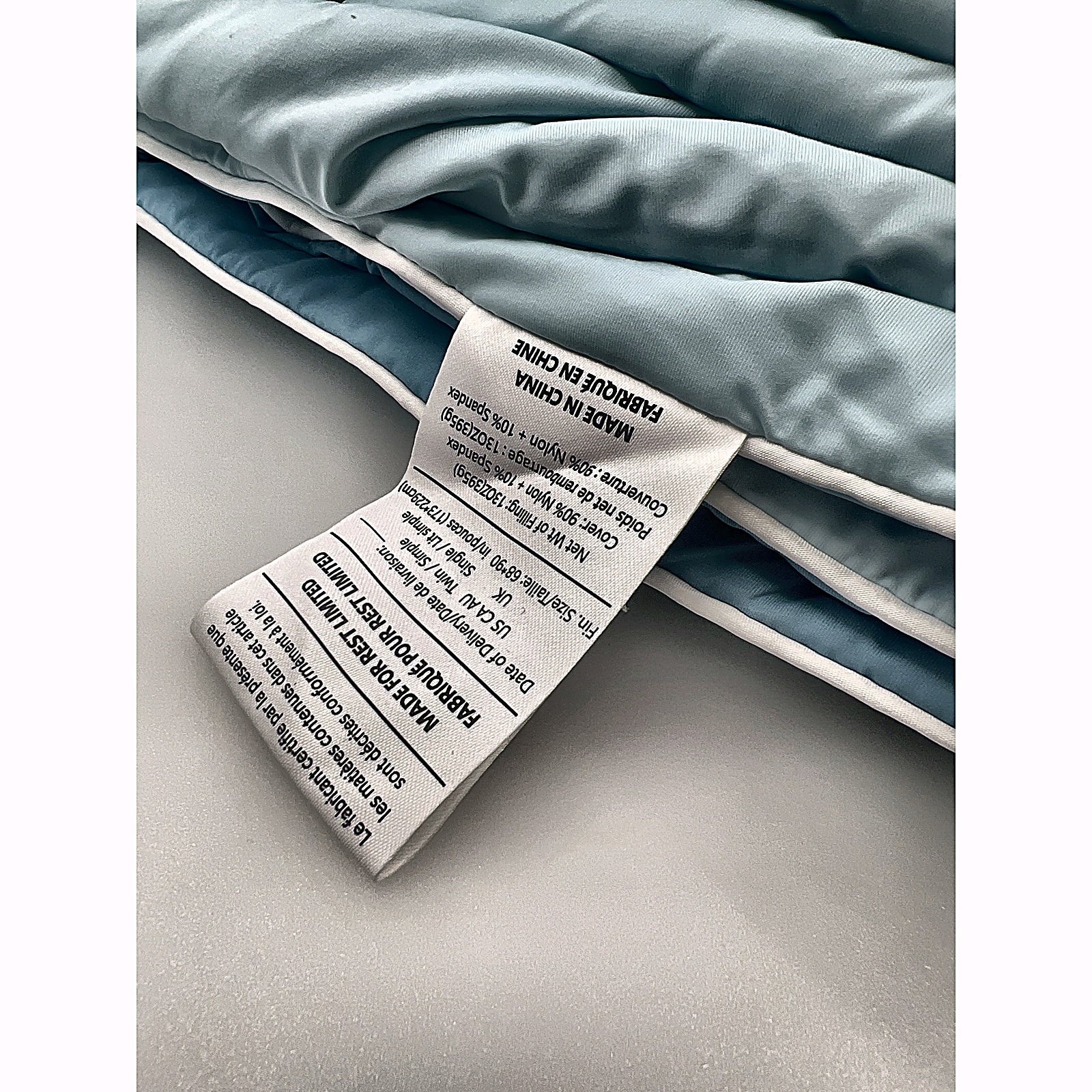 REST Evercool Cooling Comforter aqua blue folded with white piping