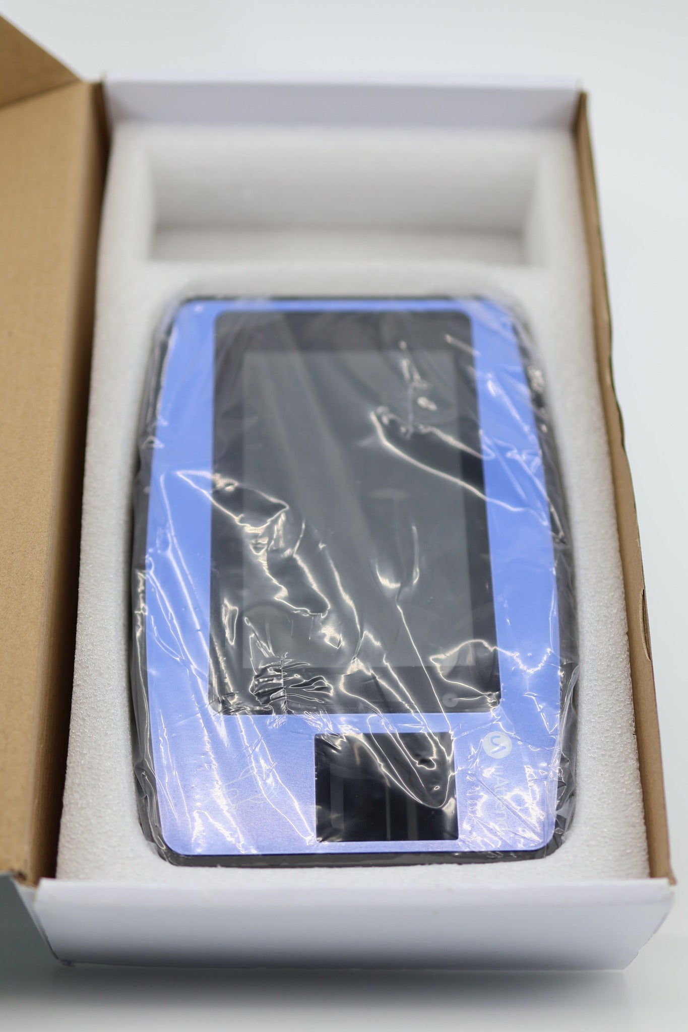 uAttend NX2500 Time Clock device in foam tray