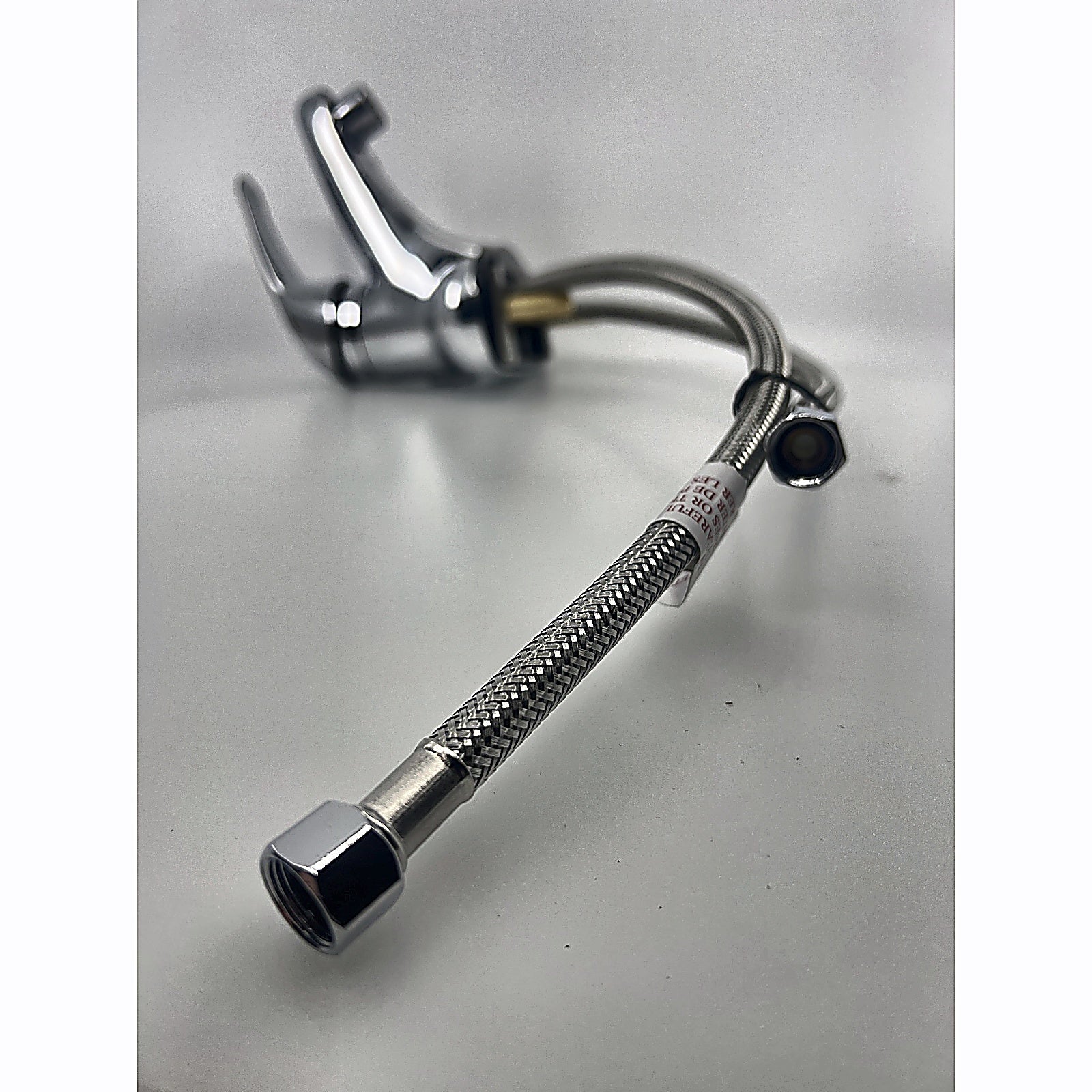 Zurn Z7440-XL supply line close-up with faucet in background