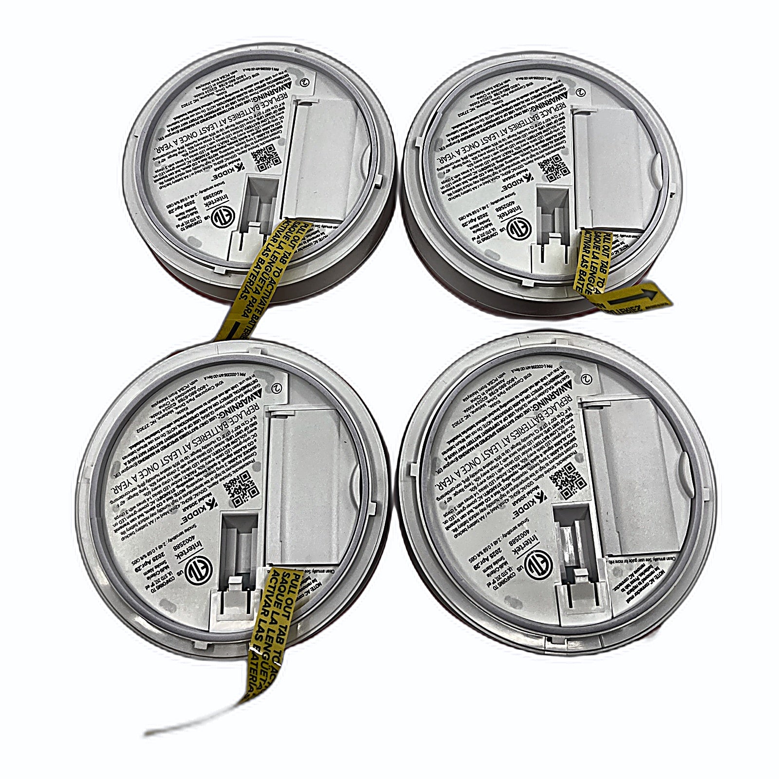 Kidde smoke detector units back with battery compartments open