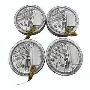 Kidde smoke detector units back with battery compartments open