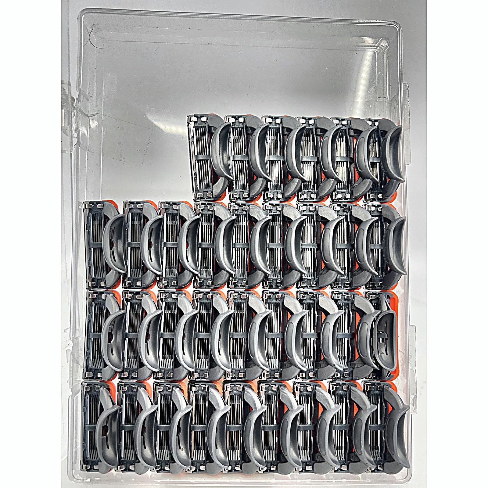 Fusion 5 style razor blade refills in clear tray overhead view